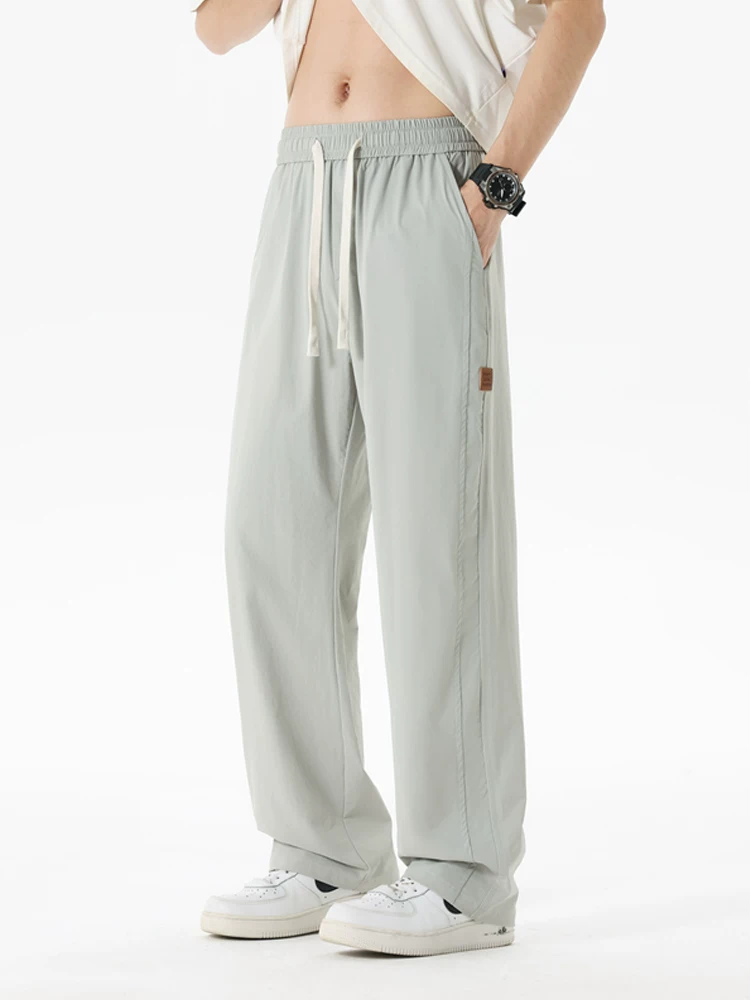 Quần dài Jeanswest dáng rộng, chất liệu lụa băng mỏng, phong cách thường ngày dành cho nam, quần dài thương hiệu thời trang cao cấp mùa hè.