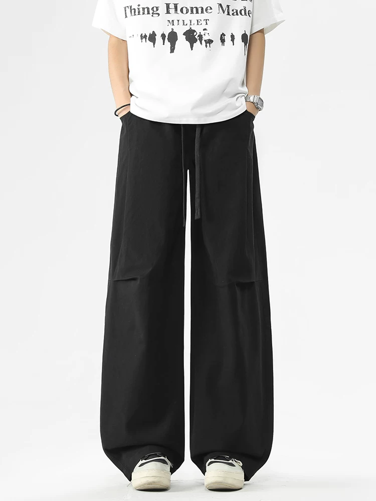 Quần jeanswest kiểu Mỹ thời thượng, dáng rộng, phong cách casual dành cho nam, mẫu mới xuân thu 2026, quần cargo dây rút cao cấp.