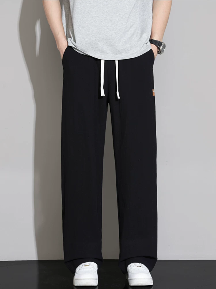 Quần dài nam Jeanswest chất liệu lụa băng mỏng, dáng suông, phong cách casual, xu hướng mùa hè, thương hiệu cao cấp, quần ống rộng thời trang.