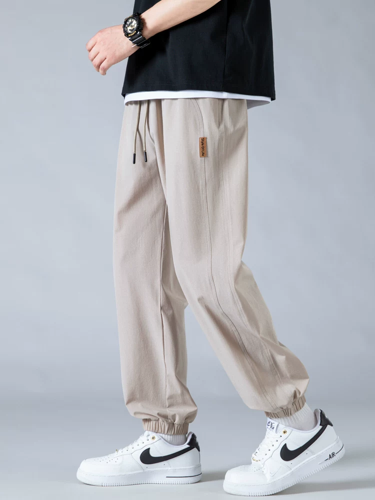 Quần jogger nam Jeanswest Ice Silk mỏng kiểu Mỹ thời trang thương hiệu nổi tiếng mùa hè 2025 mới, dáng rộng, đa năng, phong cách thường ngày