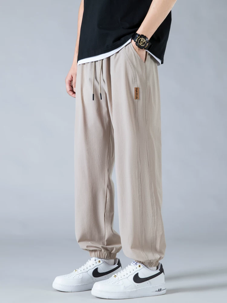 Quần jogger nam Jeanswest Ice Silk mỏng kiểu Mỹ thời trang thương hiệu nổi tiếng mùa hè 2025 mới, dáng rộng, đa năng, phong cách thường ngày