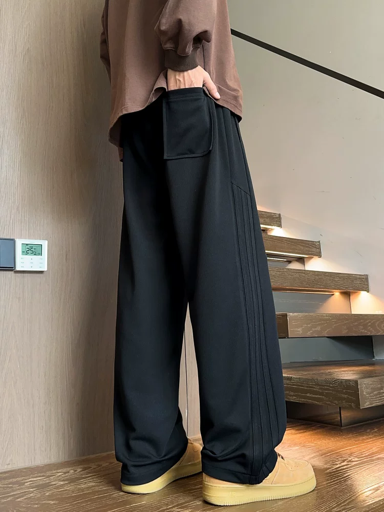 Quần dài ống đứng màu đen phong cách Mỹ của Jeanswest dành cho nam, mẫu mới mùa xuân 2026, quần dài cao cấp, quần thể thao.