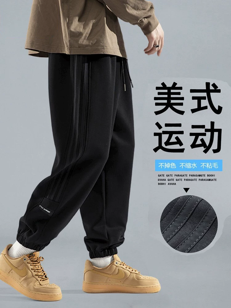 Quần jogger dáng rộng màu đen của Jeanswest dành cho nam, quần thể thao hợp thời trang phong cách Mỹ dành cho giới trẻ mùa xuân và mùa thu.