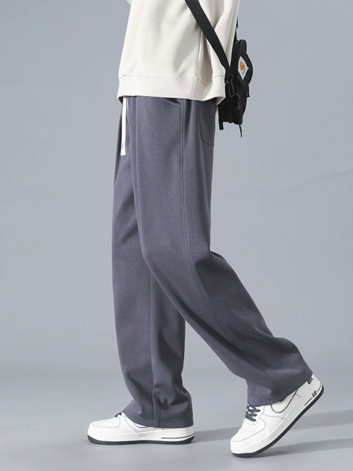 Quần jeanswest đơn sắc đơn giản dành cho nam, phong cách mới mùa xuân thu, quần thể thao ống rộng dáng suông đa năng.
