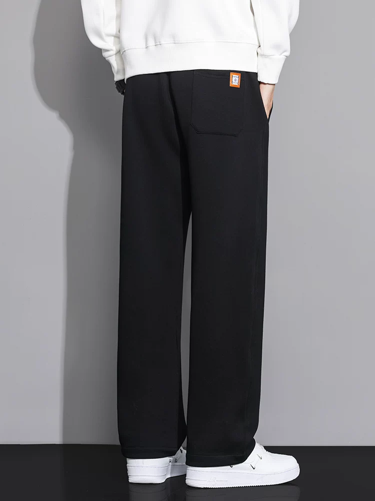 Quần jeanswest ống rộng dáng suông dành cho nam, quần thể thao dáng rộng màu trơn hợp thời trang mùa xuân.