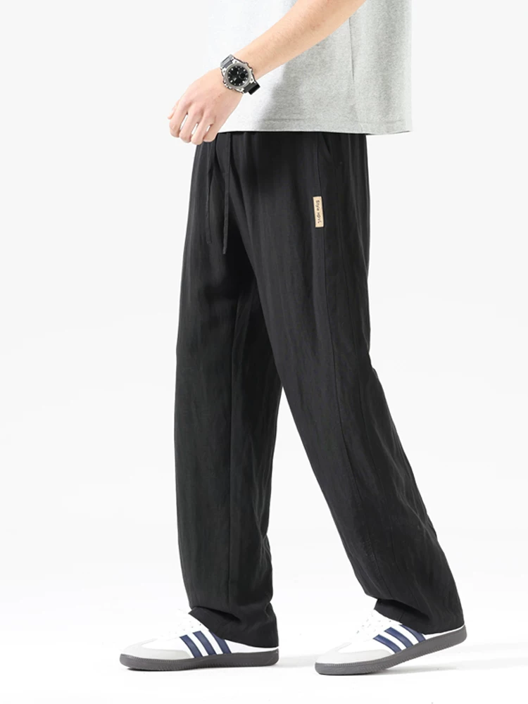 Quần dài ống rộng kiểu Mỹ của Jeanswest dành cho nam, mùa xuân thu, quần dài ống rộng có dây rút, quần dài thương hiệu thời trang cao cấp.