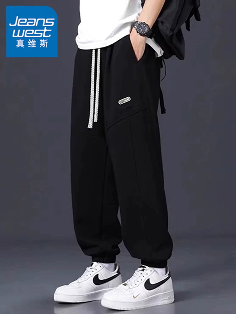 Quần thể thao dáng rộng in chữ màu trơn của Jeanswest dành cho nam, quần dài thể thao đa năng lót lông cừu mùa thu đông.