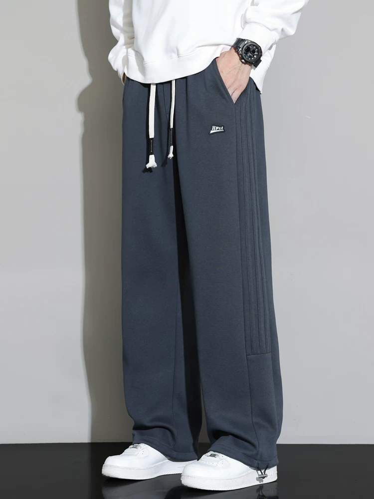Quần jogger nam Jeanswest 2026 mới, dáng rộng, màu xám, chất liệu mềm mại, đa năng, phong cách thể thao, dài.