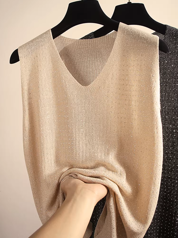 Hàng thanh lý áo vest nữ kiểu Âu, có mác, chất liệu lụa bóng, đính đá, cổ V, dáng rộng, màu trơn, không tay.