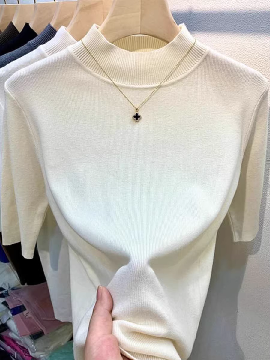 Quần áo nữ châu Âu giảm giá có thương hiệu, áo sơ mi cổ cao nửa cổ có nhãn cắt, lớp bên trong có áo dệt kim tay giữa, áo len ôm dáng thon gọn.