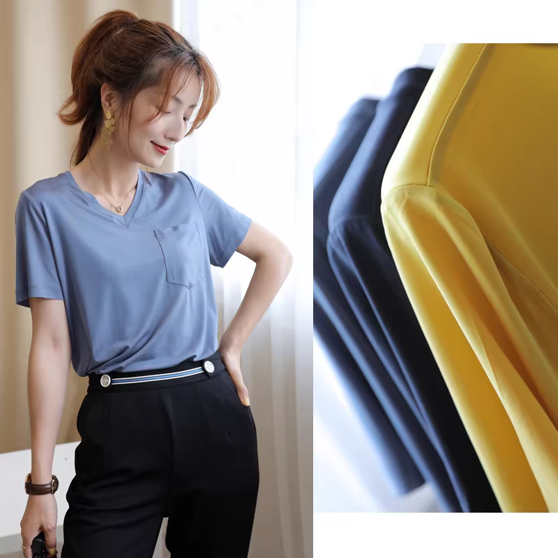 Áo thun nữ cổ V chất liệu tơ cupro nhuộm thảo mộc, thân thiện với môi trường, đã qua xử lý, co giãn cao, có túi, màu sắc đang được sản xuất.