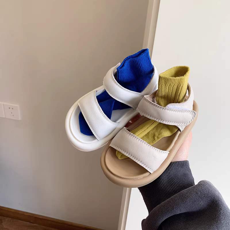 Dép da thật cho bé gái mùa hè 2025 kiểu Hàn Quốc mới, giày đi biển đế mềm cho bé trai, giày La Mã hở mũi cho bé