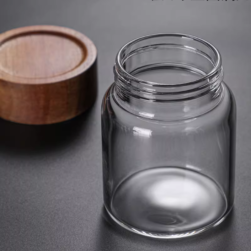 Hũ thủy tinh chịu nhiệt có nắp gỗ keo, dùng để đựng trà, hoa quả khô, đựng cà phê, bột thực phẩm trong suốt