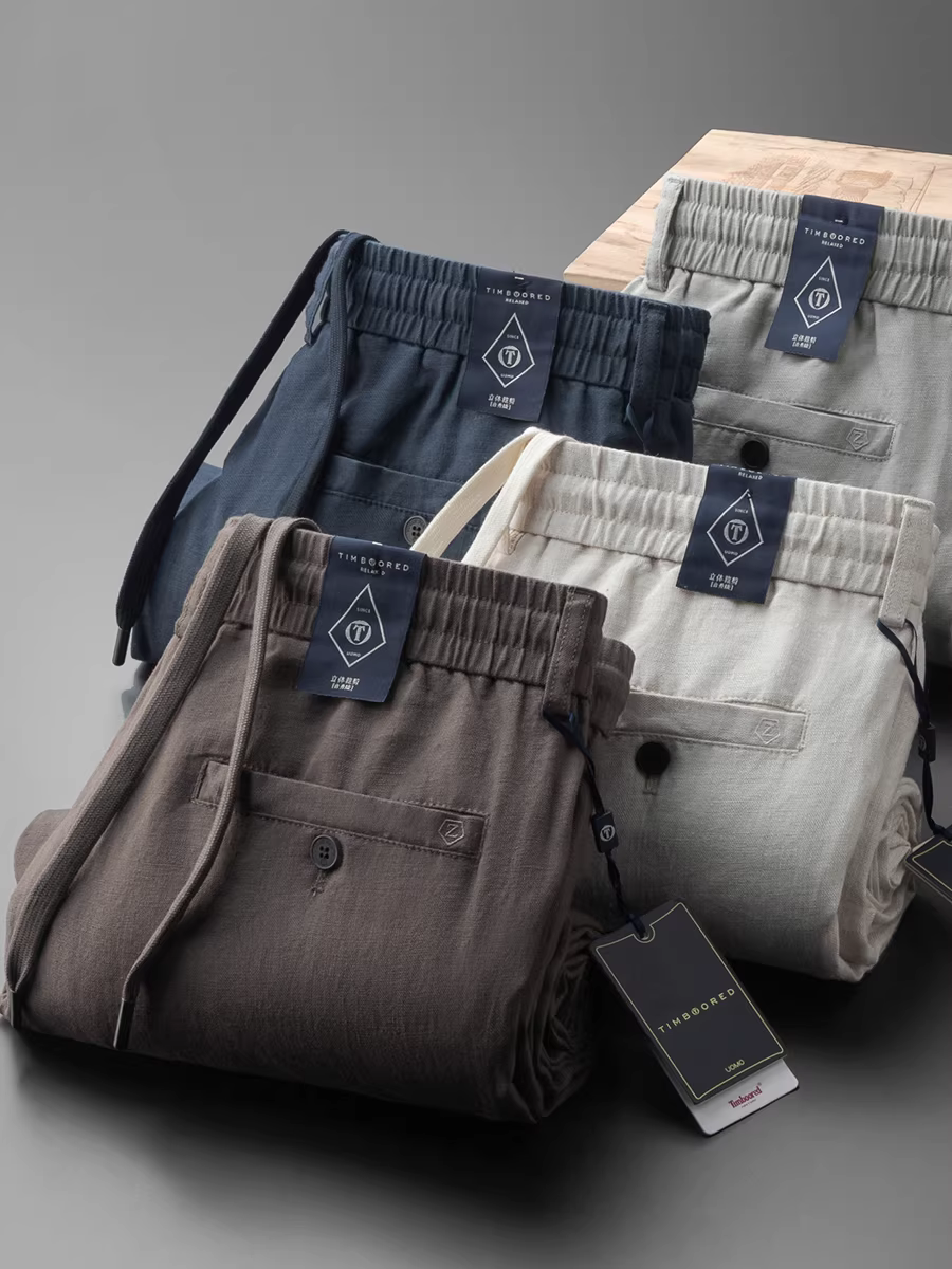 Quần âu nam mùa hè chất liệu vải lanh nguyên chất màu cà phê, dáng thẳng, mặc thoải mái và đa năng, lưng thun, mềm mại, mát mẻ, thoáng khí và không bó sát.