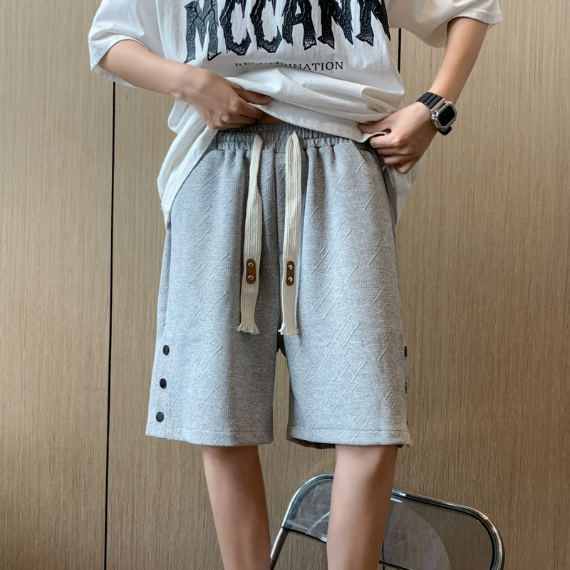 Quần short thể thao có cúc cho nam, quần jacquard thời trang phong cách Hồng Kông, quần short năm điểm dáng rộng thoải mái mùa hè.