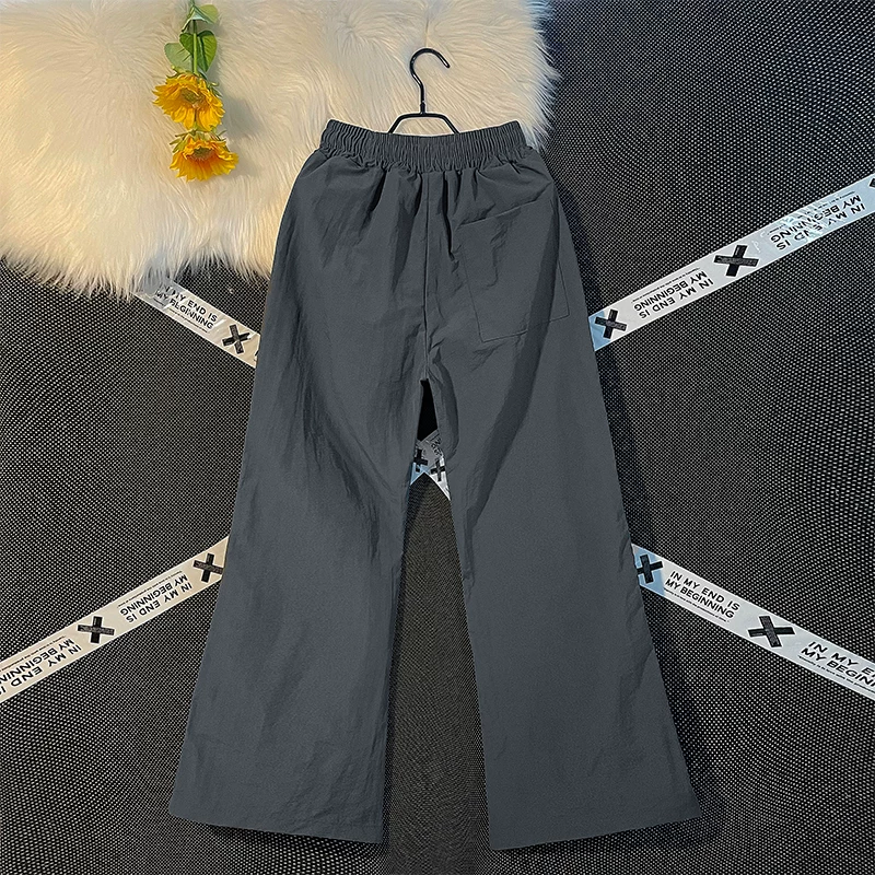 Quần nam nhẹ, nhanh khô, kiểu dáng thường ngày, quần ống loe rộng rãi mùa hè, phong cách Mỹ thời thượng, quần dù thể thao.