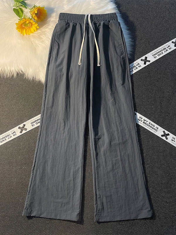 Quần dài mùa hè mỏng, nhanh khô, kiểu dáng thường ngày dành cho nam, dáng rộng, hơi loe, phong cách thời thượng, quần dù thể thao đường phố.