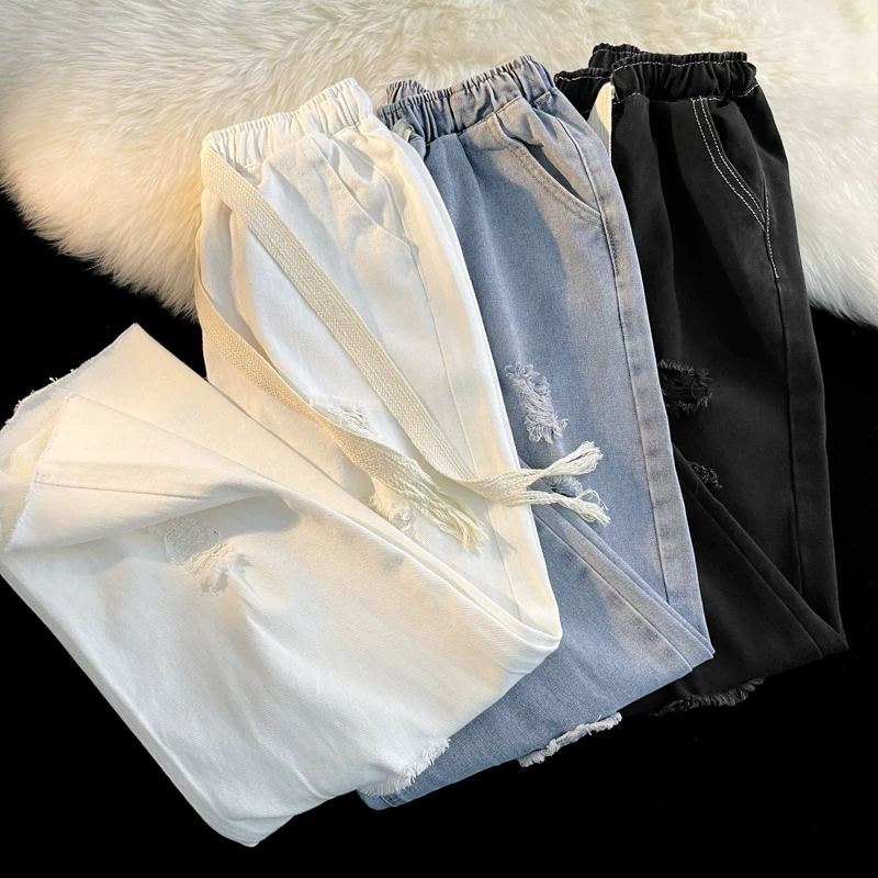 Quần jean rách kiểu Nhật dành cho nam, quần đôi sinh viên đa năng mùa hè, quần dài ống rộng có dây rút hợp thời trang.