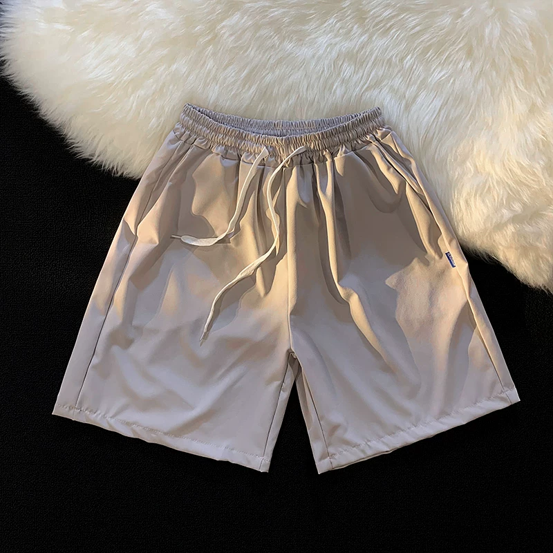 Quần short nam mùa hè chất liệu lụa băng mỏng, quần dài vừa phải màu trơn phong cách thường ngày, kiểu dáng thời thượng Hồng Kông, quần năm phần dáng rộng đa năng.