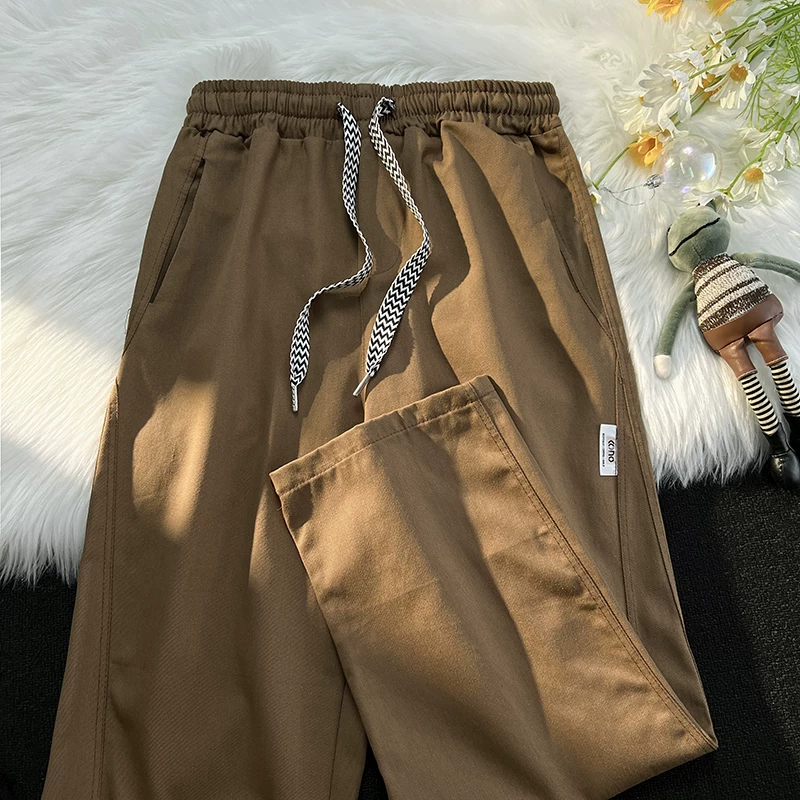 Quần công sở màu trơn cơ bản mùa xuân thu thương hiệu thời trang phong cách Nhật Bản quần nam giản dị đa năng quần dài ống rộng